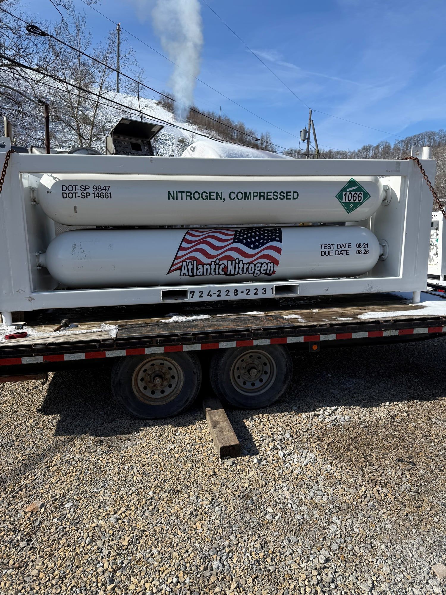 Atlantic Nitrogen compressed nitrogen tube module on a flatbed trailer, carrying the 724-228-2231 dispatch number